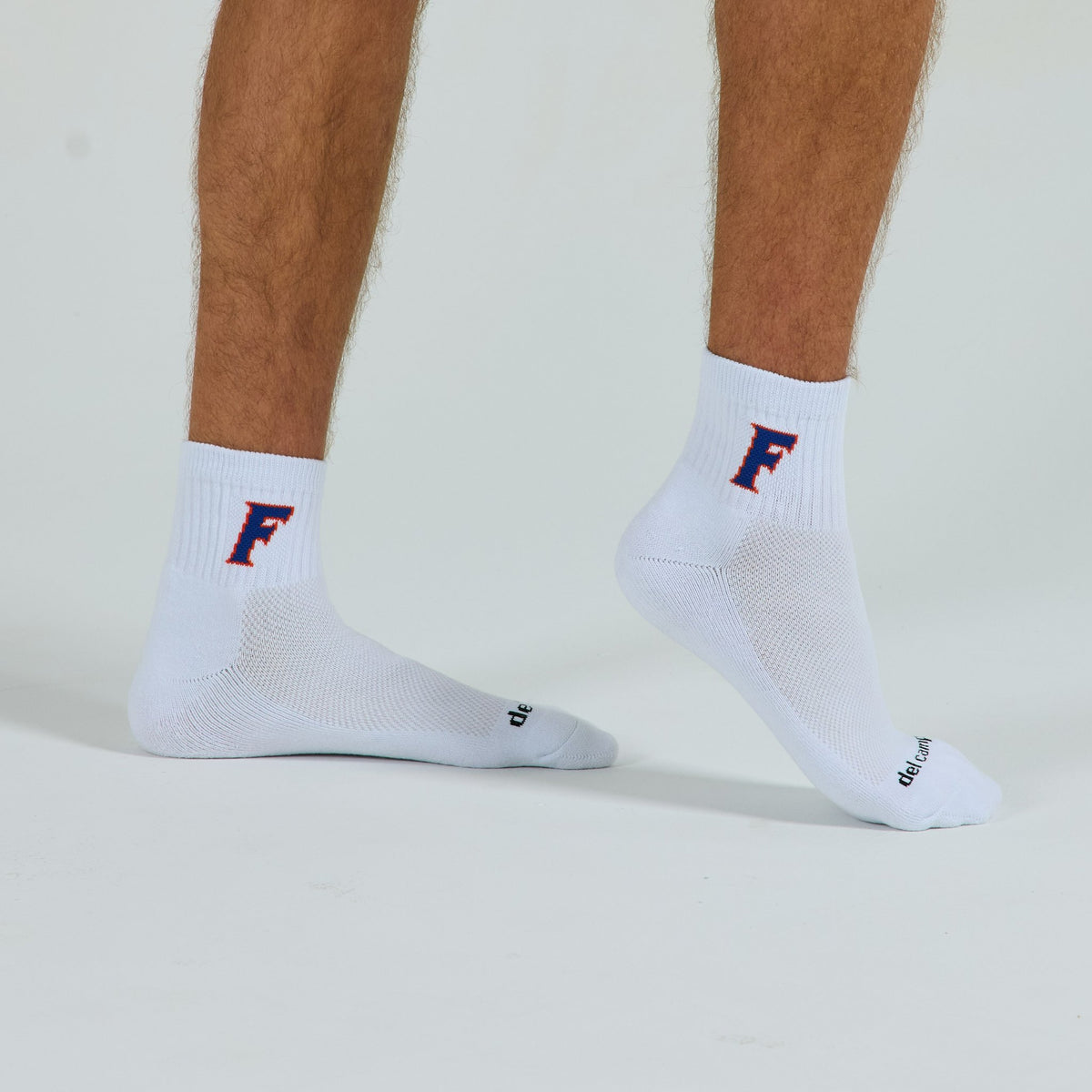 Del Campo Florida Gators Block F golf socks on a male model in studio