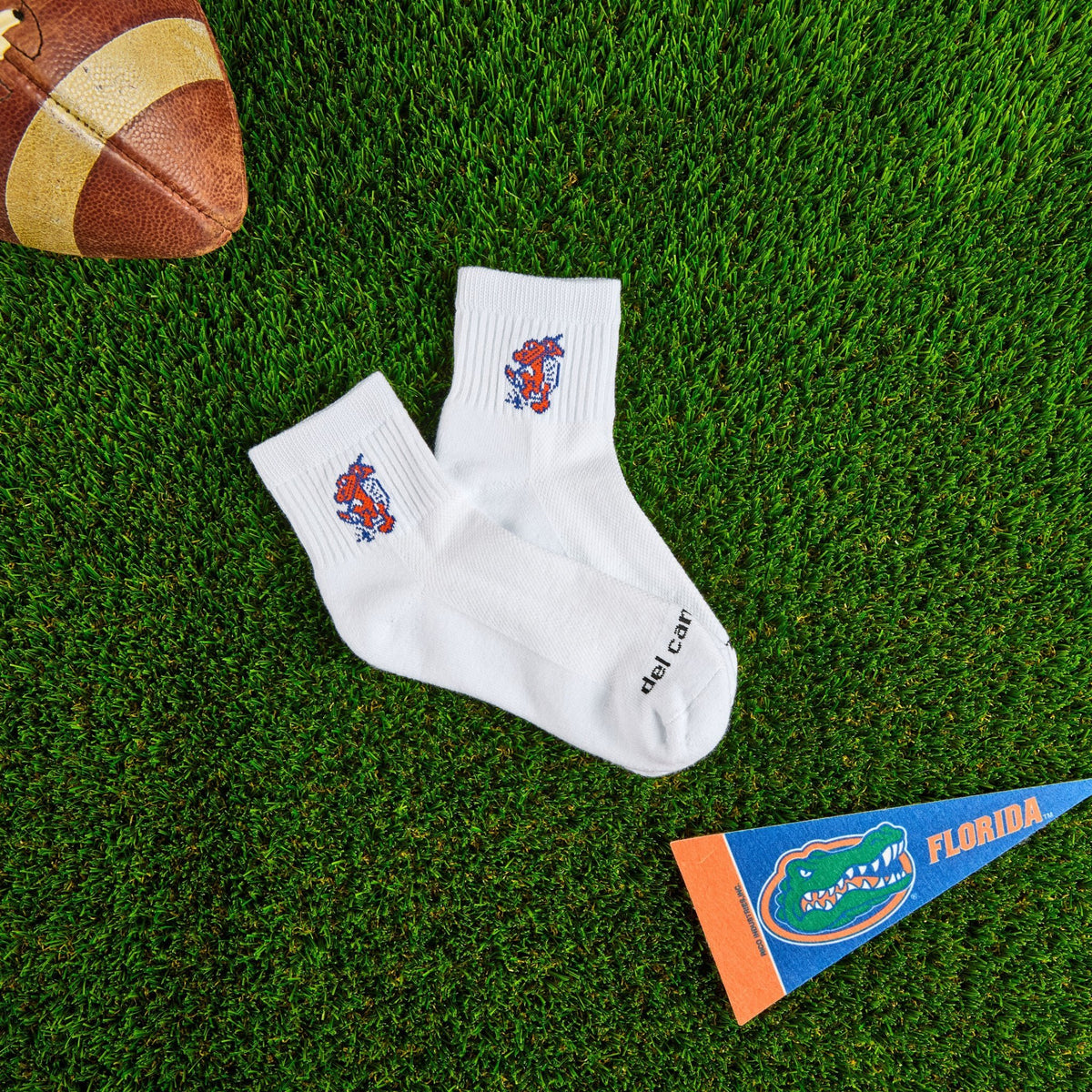 Del Campo Florida Gators Swinging Gator golf socks on turf with a team pennant