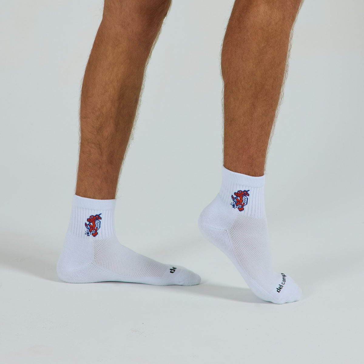 Man wearing Del Campo Florida Gators Swinging Gator golf socks, studio shot, no shoes