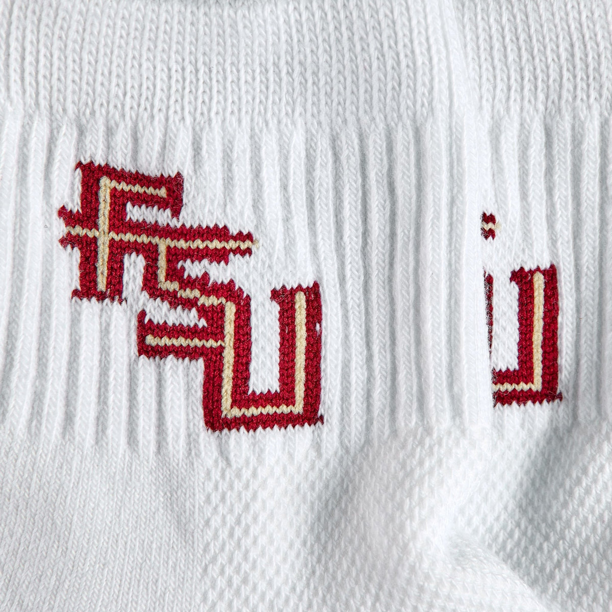 Close-up of the FSU interlock on Del Campo Florida State Pack golf socks