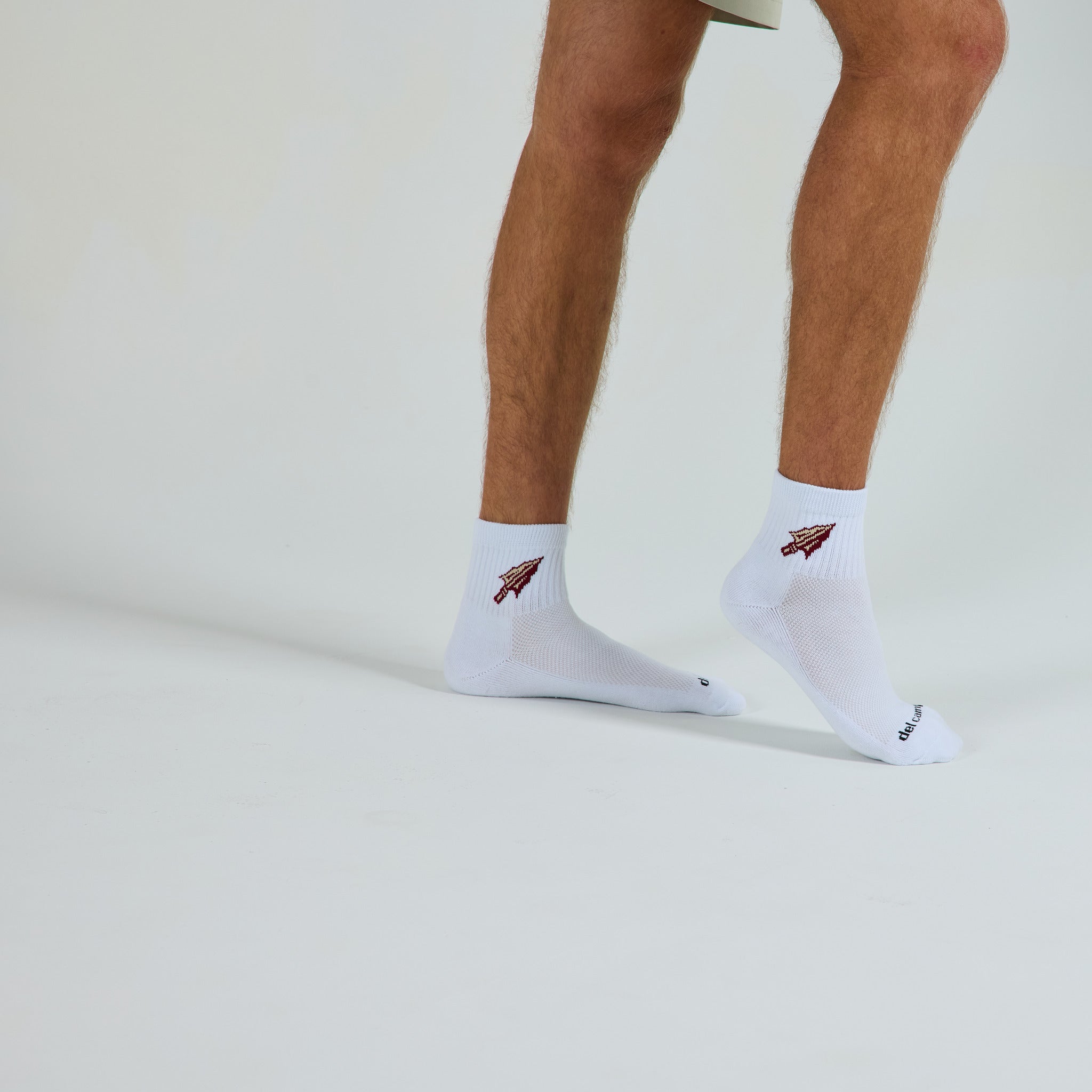 Del Campo Florida State Spear golf socks on a male model in studio