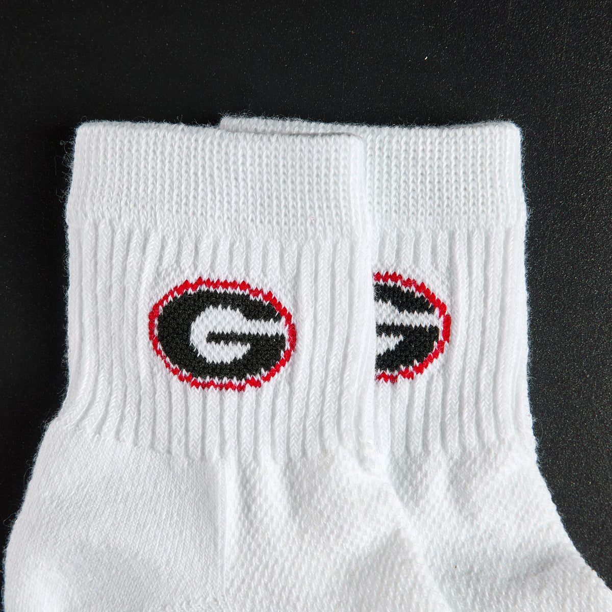 Del Campo Georgia Bulldogs golf socks, embroidered black G in a red oval detail