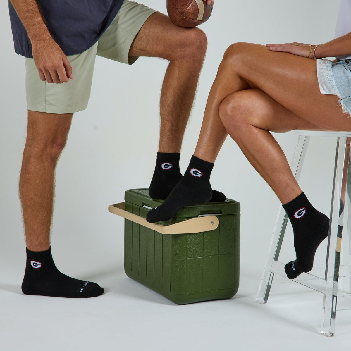 Two models wearing Del Campo Georgia Night Mode golf socks in studio