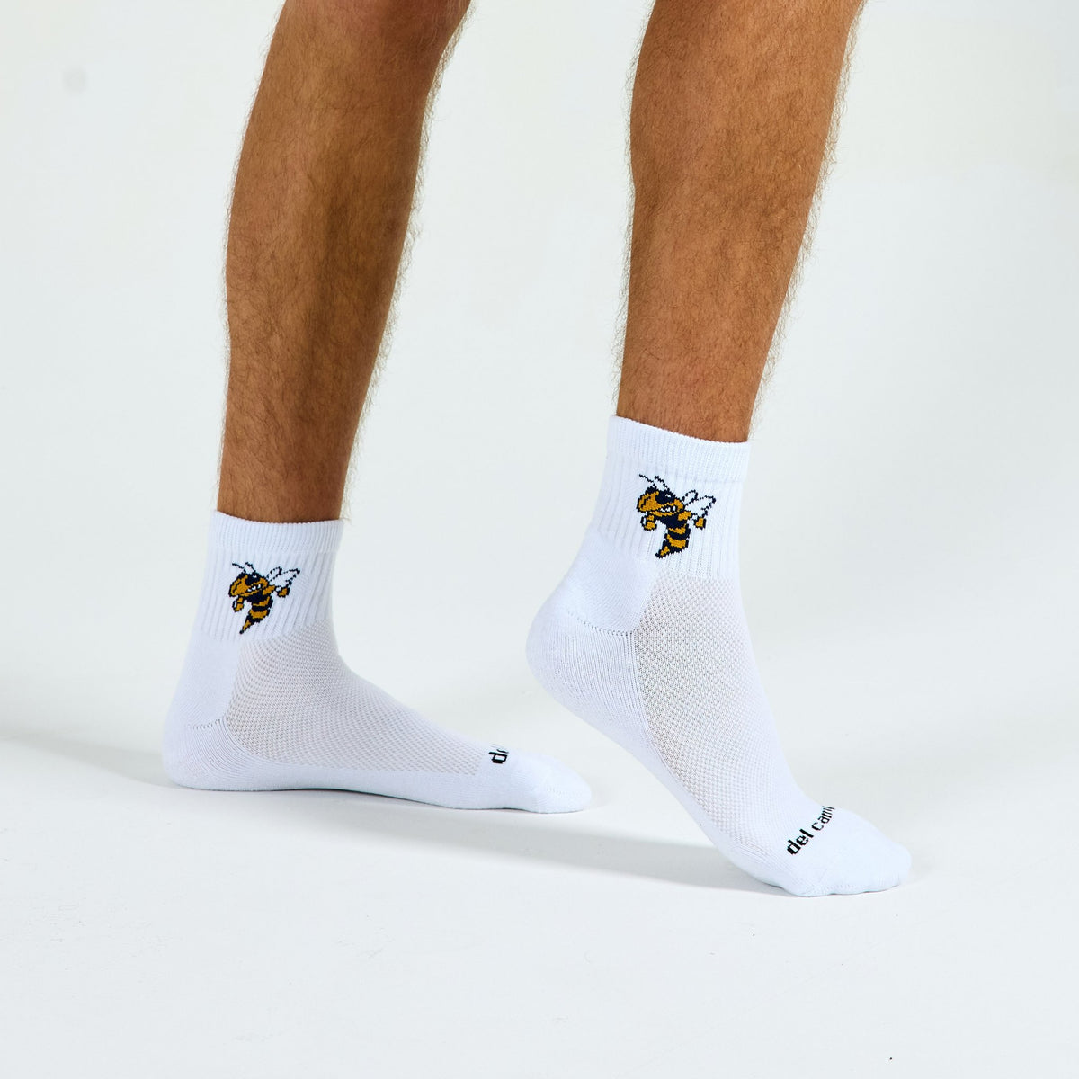 Man wearing Del Campo Georgia Tech Buzz golf socks, studio shot, no shoes