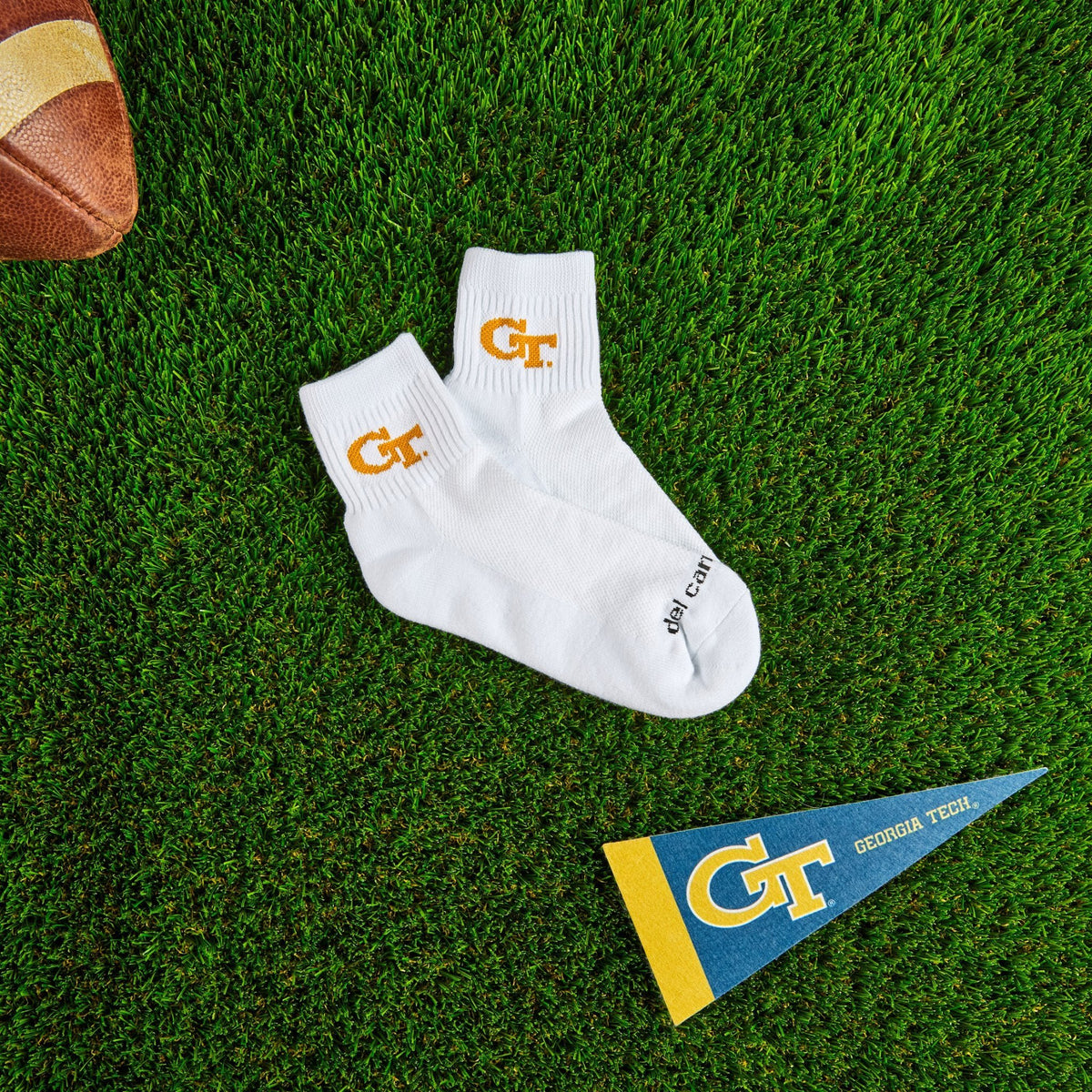Del Campo Georgia Tech GT golf socks on turf with a team pennant