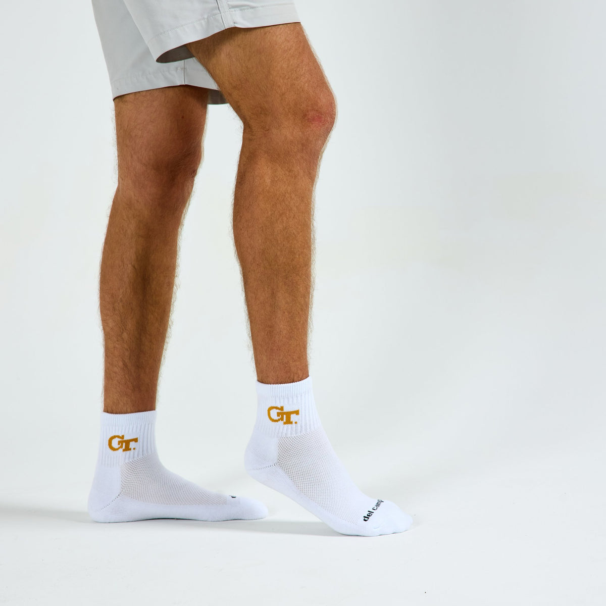 Man wearing Del Campo Georgia Tech GT golf socks, studio shot, no shoes