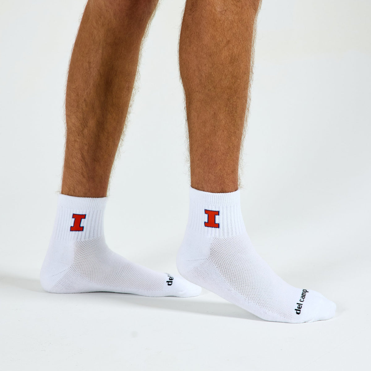 Man wearing Del Campo Illinois Fighting Illini golf socks, studio shot, no shoes