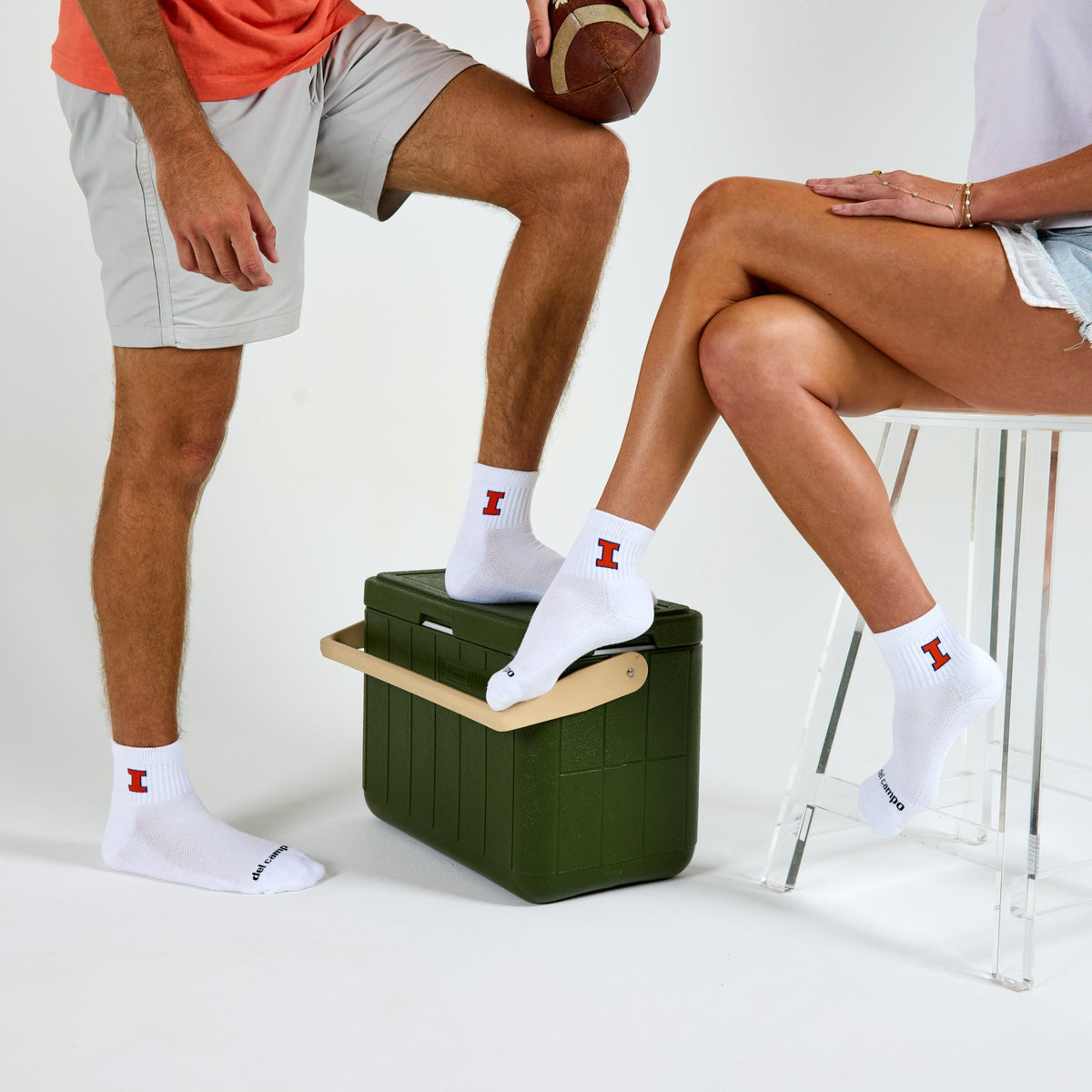 Two models wearing Del Campo Illinois Fighting Illini golf socks in studio