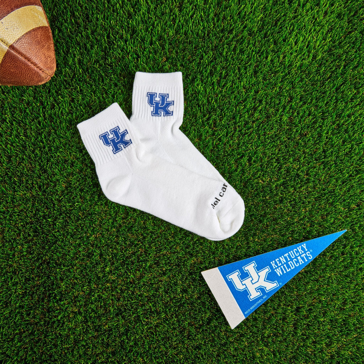 Del Campo Kentucky Wildcats golf socks on turf with a team pennant