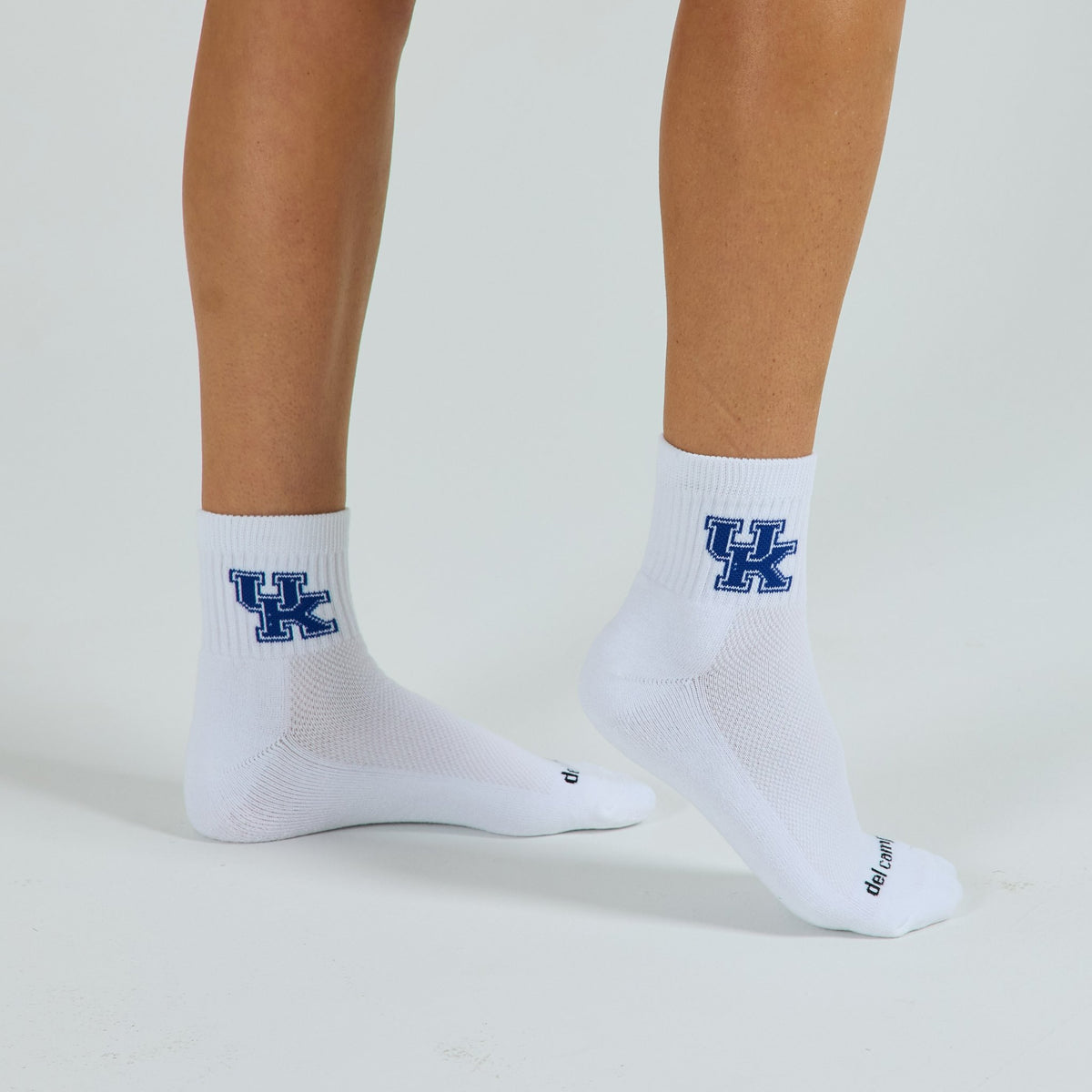 Man wearing Del Campo Kentucky Wildcats golf socks, studio shot, no shoes