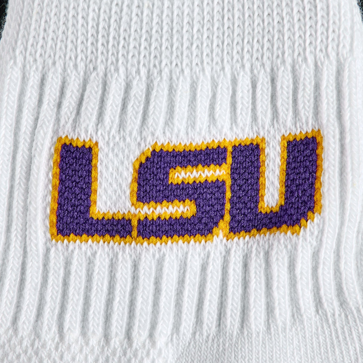 Close-up of the purple and gold LSU wordmark on Del Campo LSU Tigers golf socks