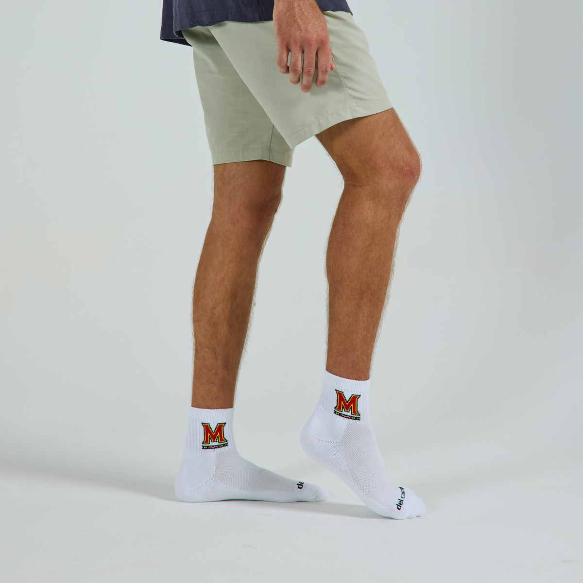 Del Campo Maryland Terrapins golf socks on a male model in studio