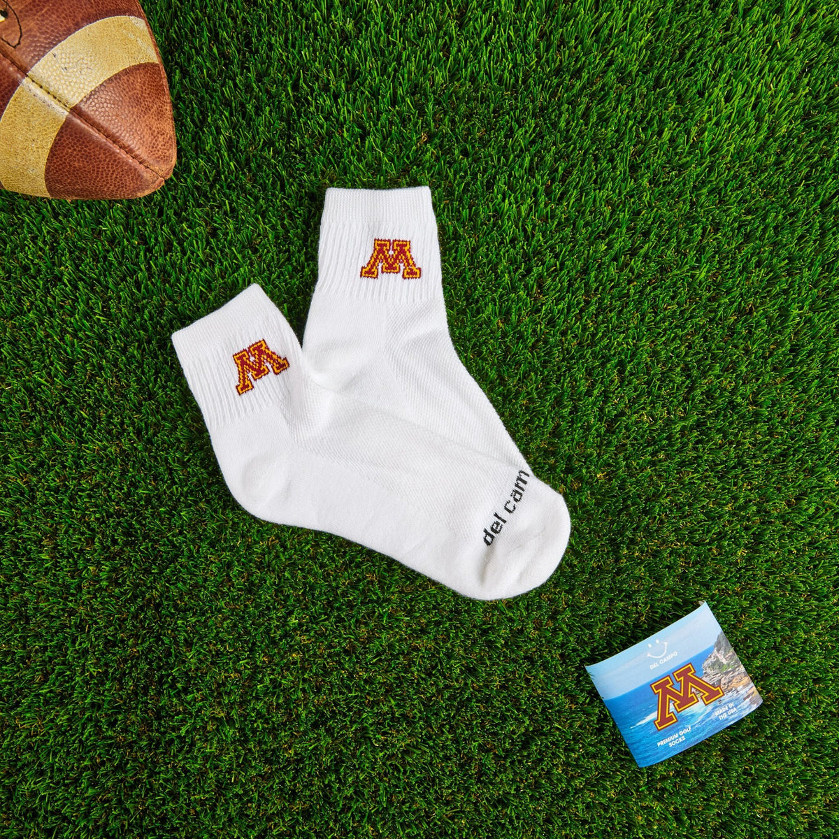 Del Campo Minnesota Golden Gophers golf socks on turf with a team pennant