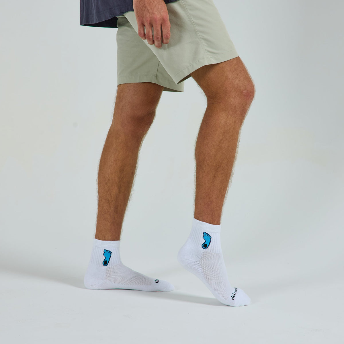 Del Campo North Carolina Tar Heel golf socks on a male model in studio