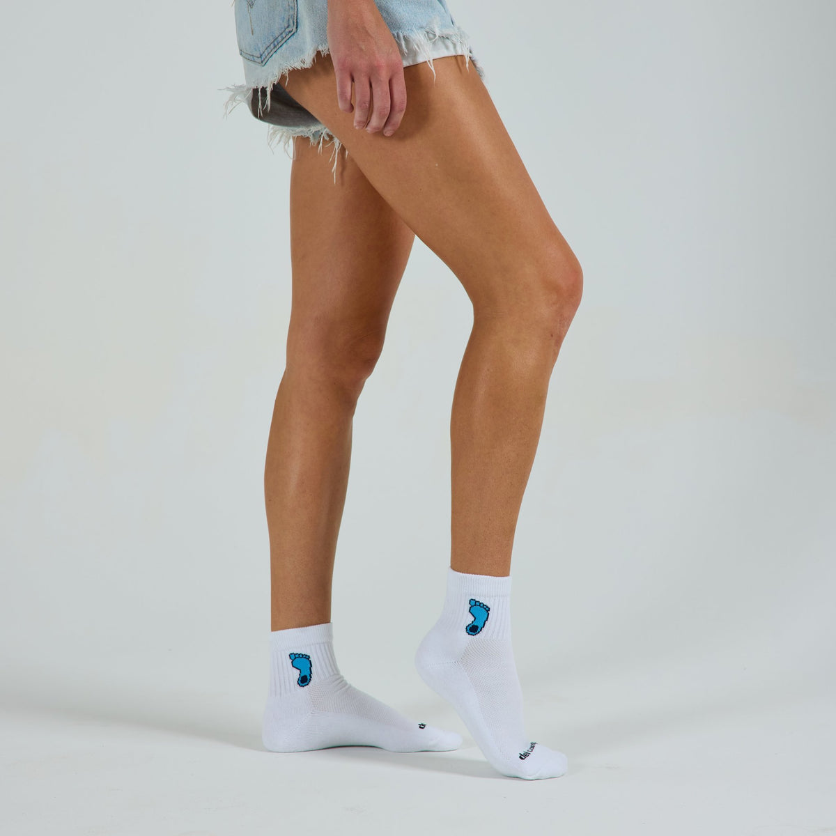 Del Campo North Carolina Tar Heel golf socks on a female model in studio