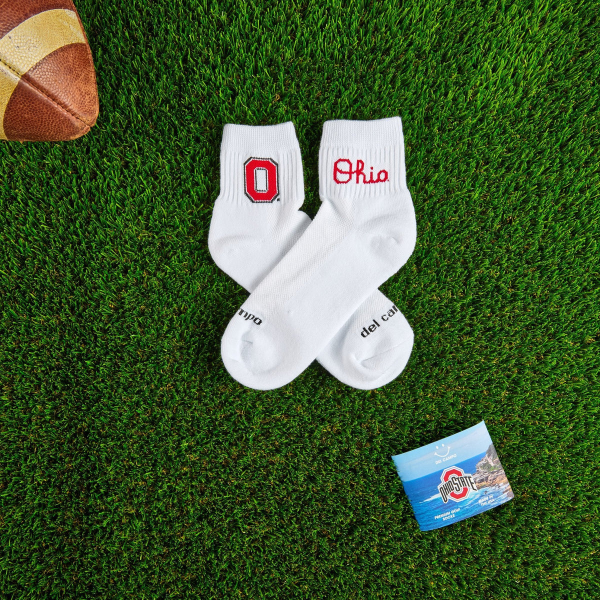 Del Campo Ohio State Buckeyes golf socks on turf with a team pennant