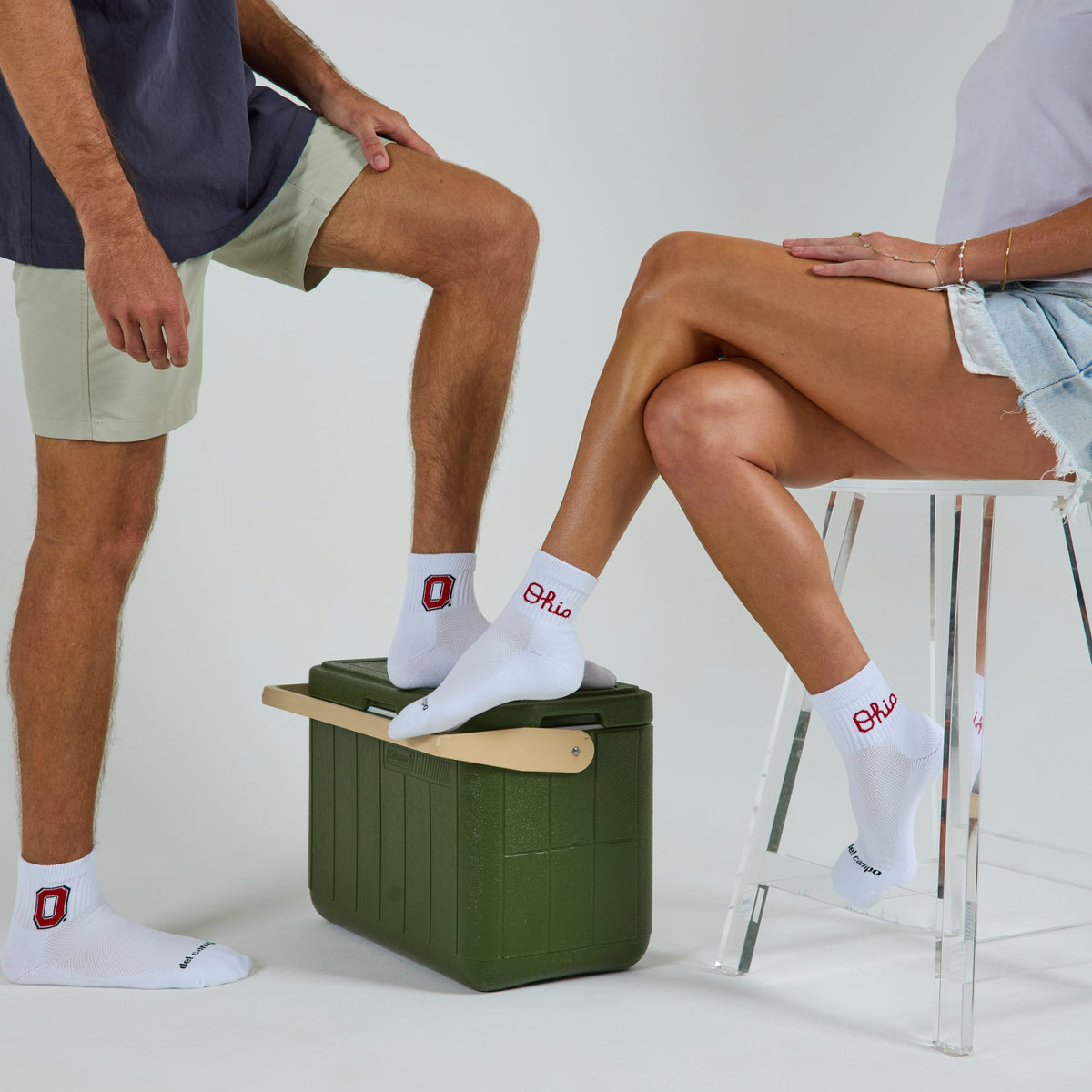 Two models wearing Del Campo Ohio State Buckeyes golf socks in studio