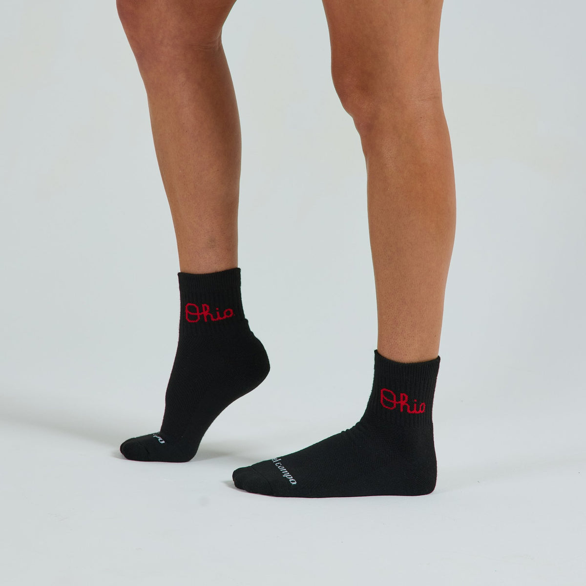Del Campo Ohio State Night Mode golf socks on a female model in studio
