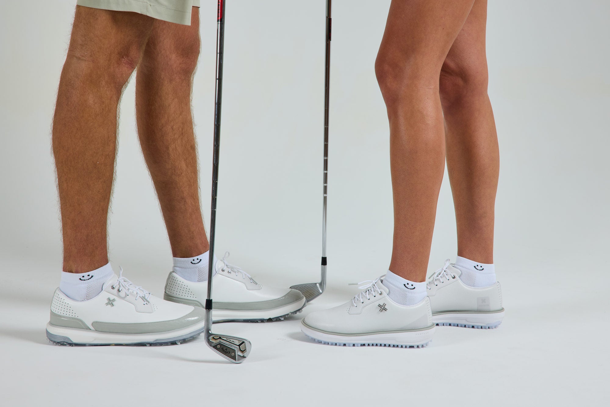 Smiley Lowcut Socks on two golfers in white golf shoes - del campo