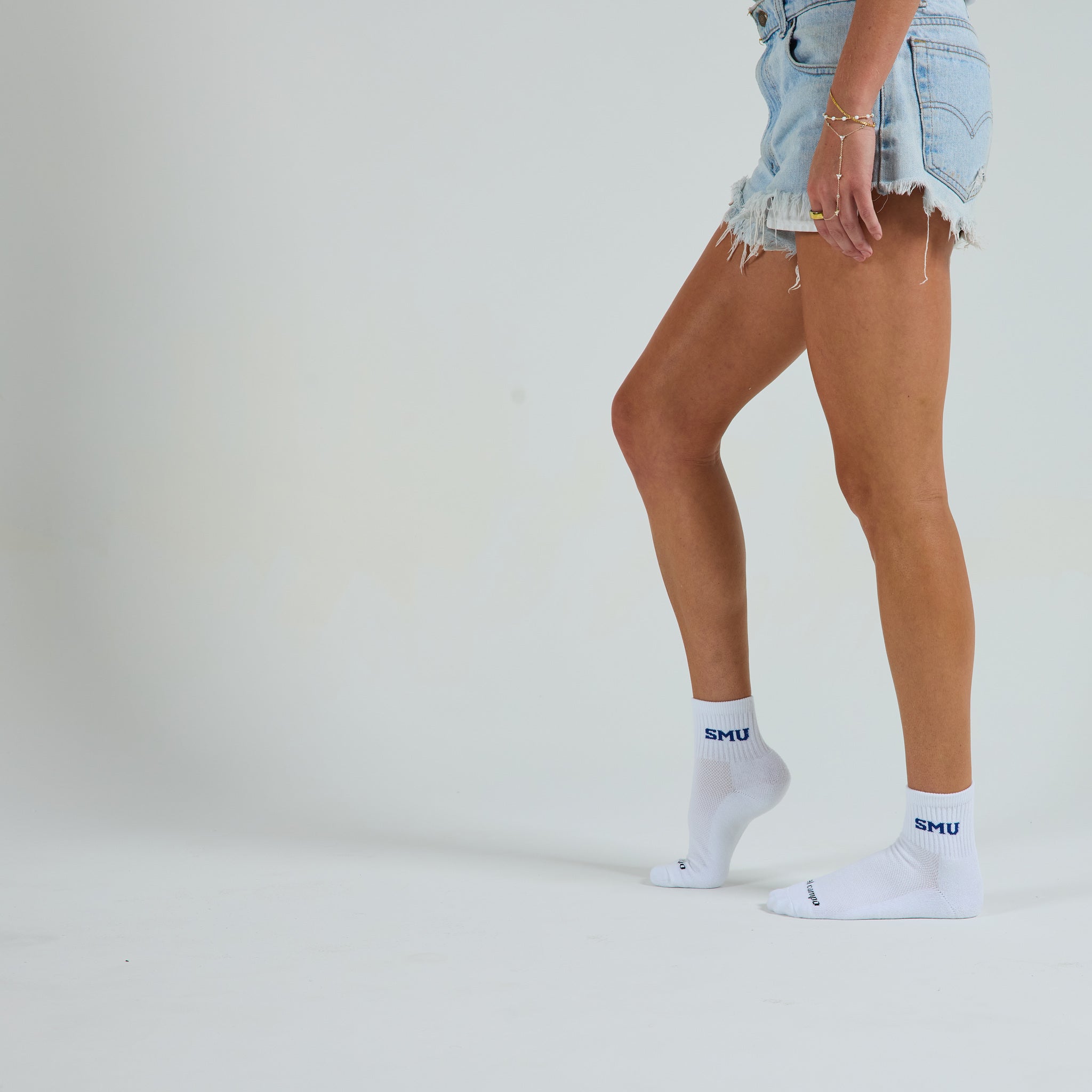 Del Campo SMU Mustangs golf socks on a female model in studio