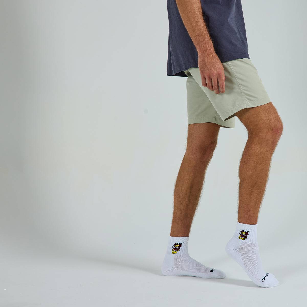 Del Campo South Carolina Cocky golf socks on a male model in studio