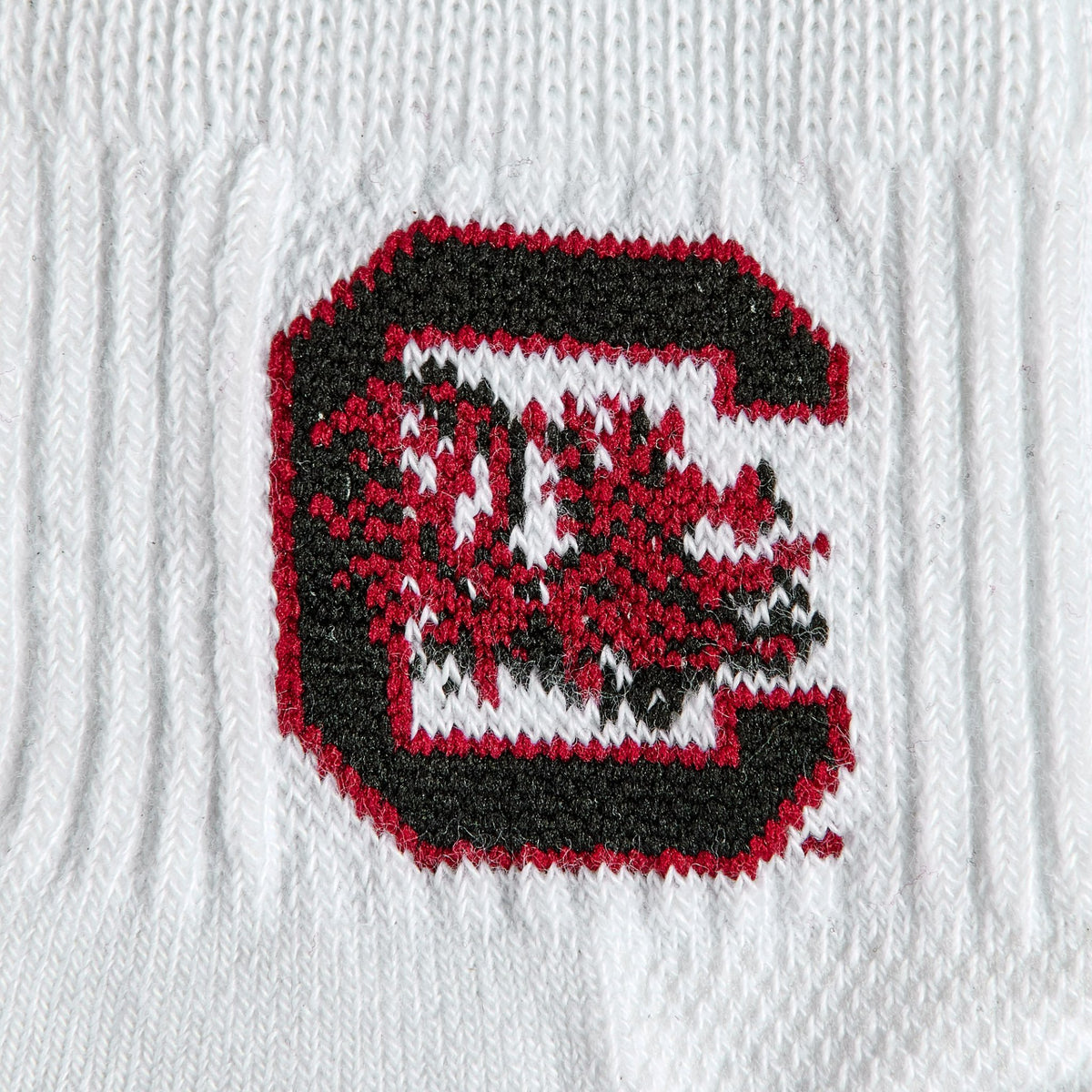 Close-up of the garnet and black block C on Del Campo South Carolina Gamecocks golf socks