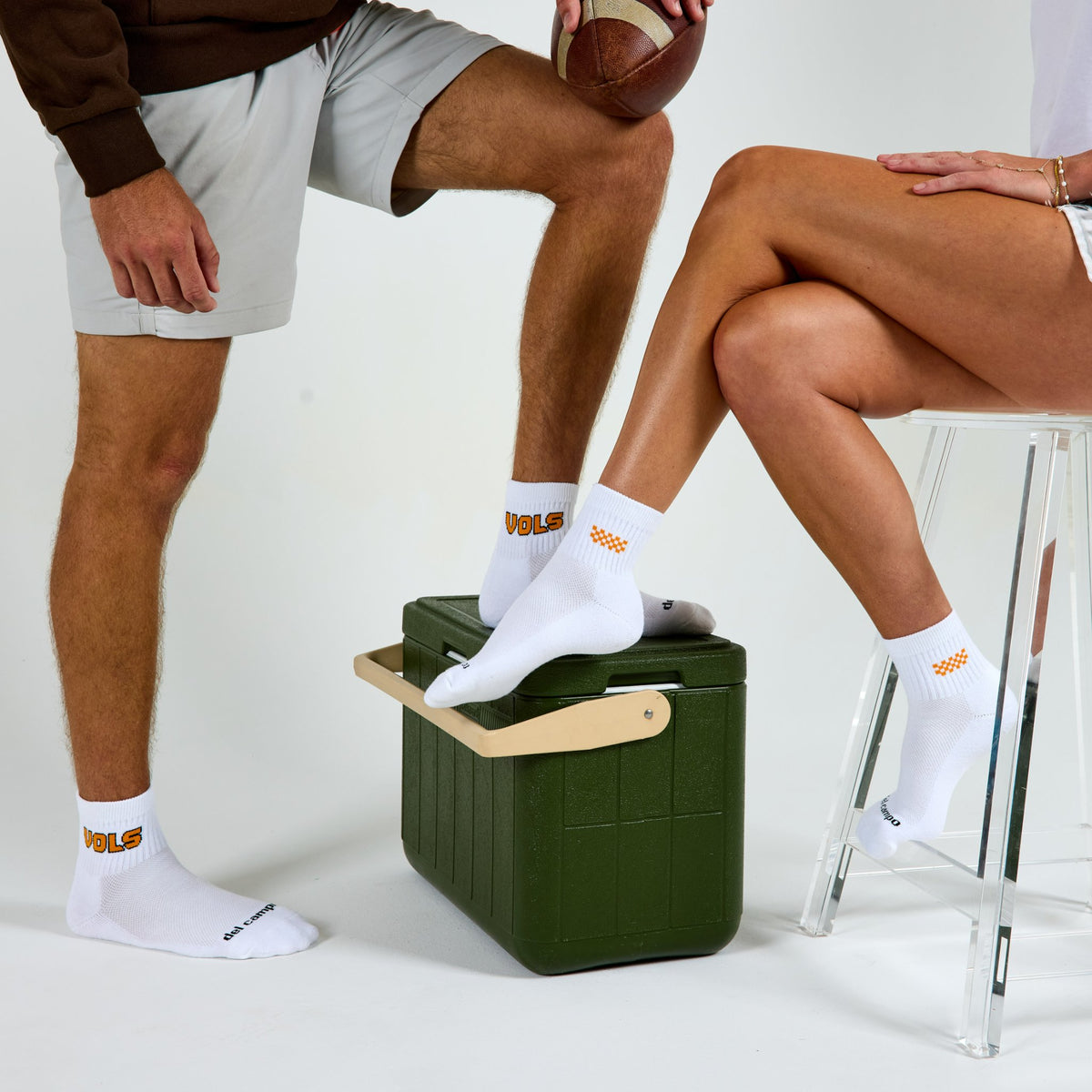 Two models wearing Del Campo Tennessee Block golf socks in studio