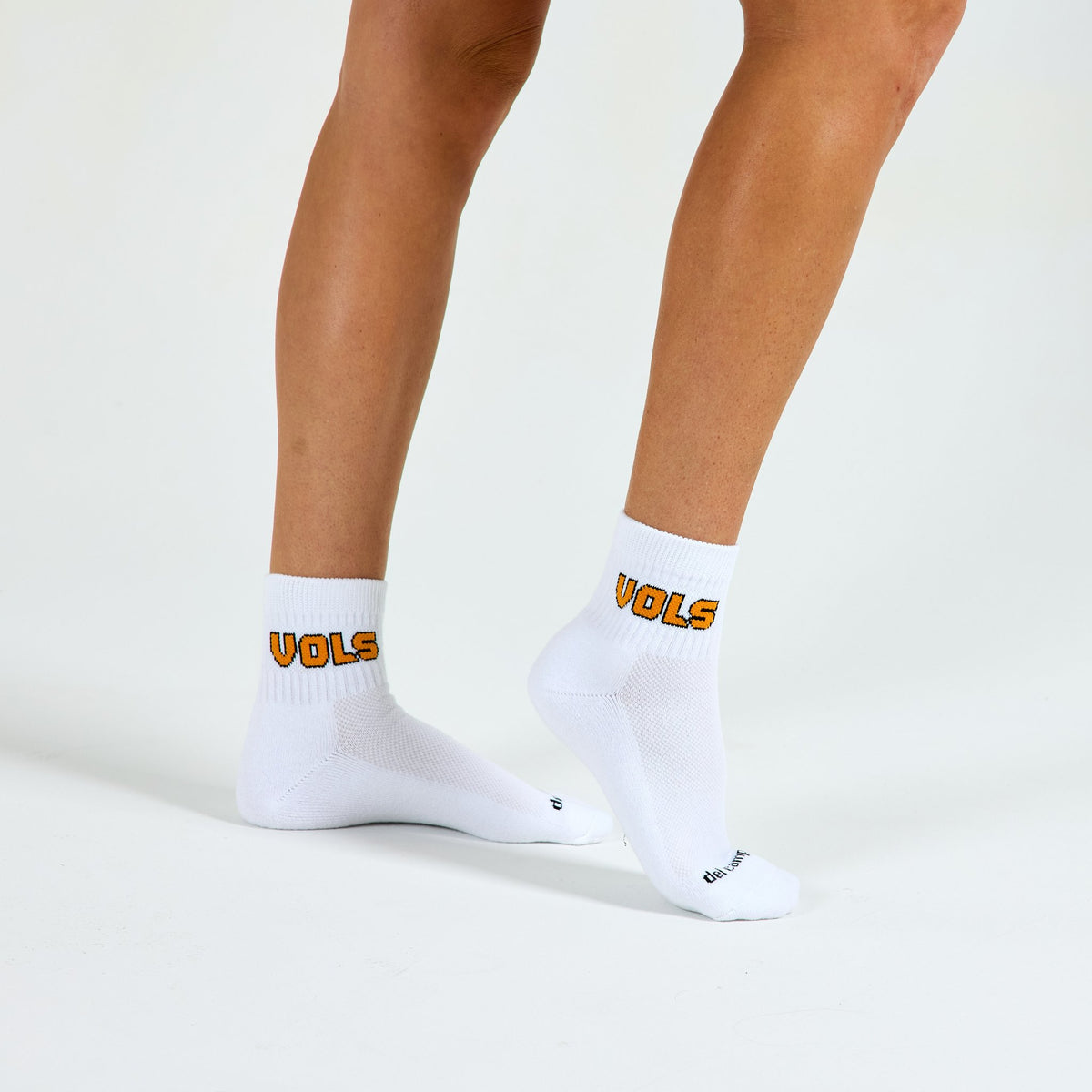 Woman wearing Del Campo Tennessee Block golf socks, studio shot, no shoes