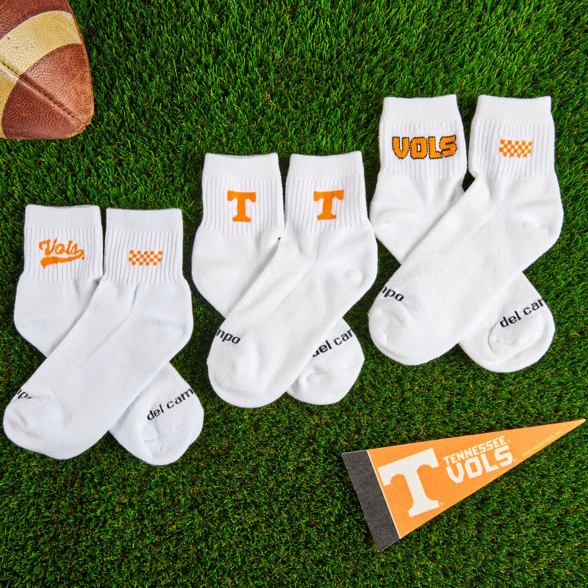 Del Campo Tennessee Pack golf socks on turf with a team pennant
