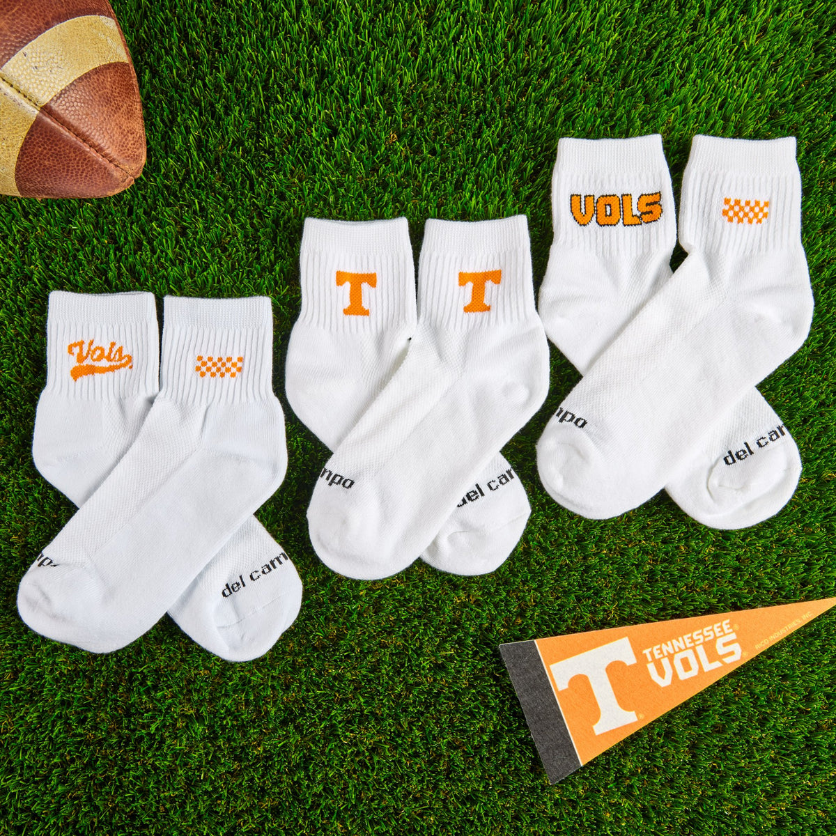 Del Campo Tennessee Pack golf socks on turf with a team pennant
