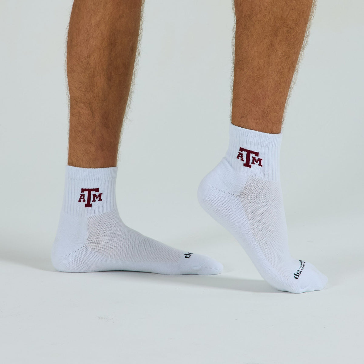 Del Campo Texas A&M Aggies golf socks on a male model in studio