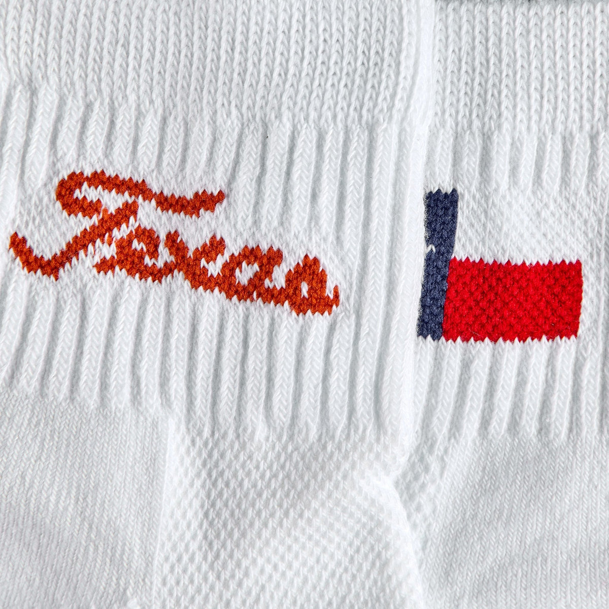 Close-up of the burnt orange Texas script wordmark on Del Campo Texas Longhorns Pack golf socks