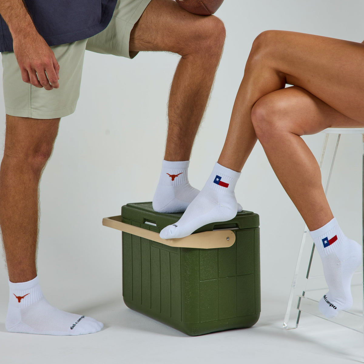 Two models in Del Campo Texas Longhorns pack socks, Longhorn and state flag designs