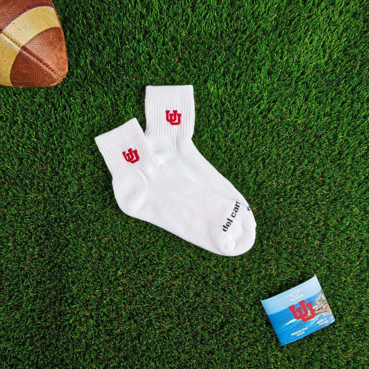 Del Campo Utah Utes golf socks on turf with a team pennant