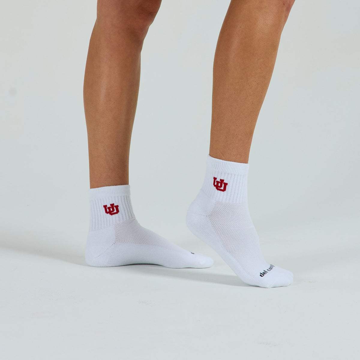 Man wearing Del Campo Utah Utes golf socks, studio shot, no shoes
