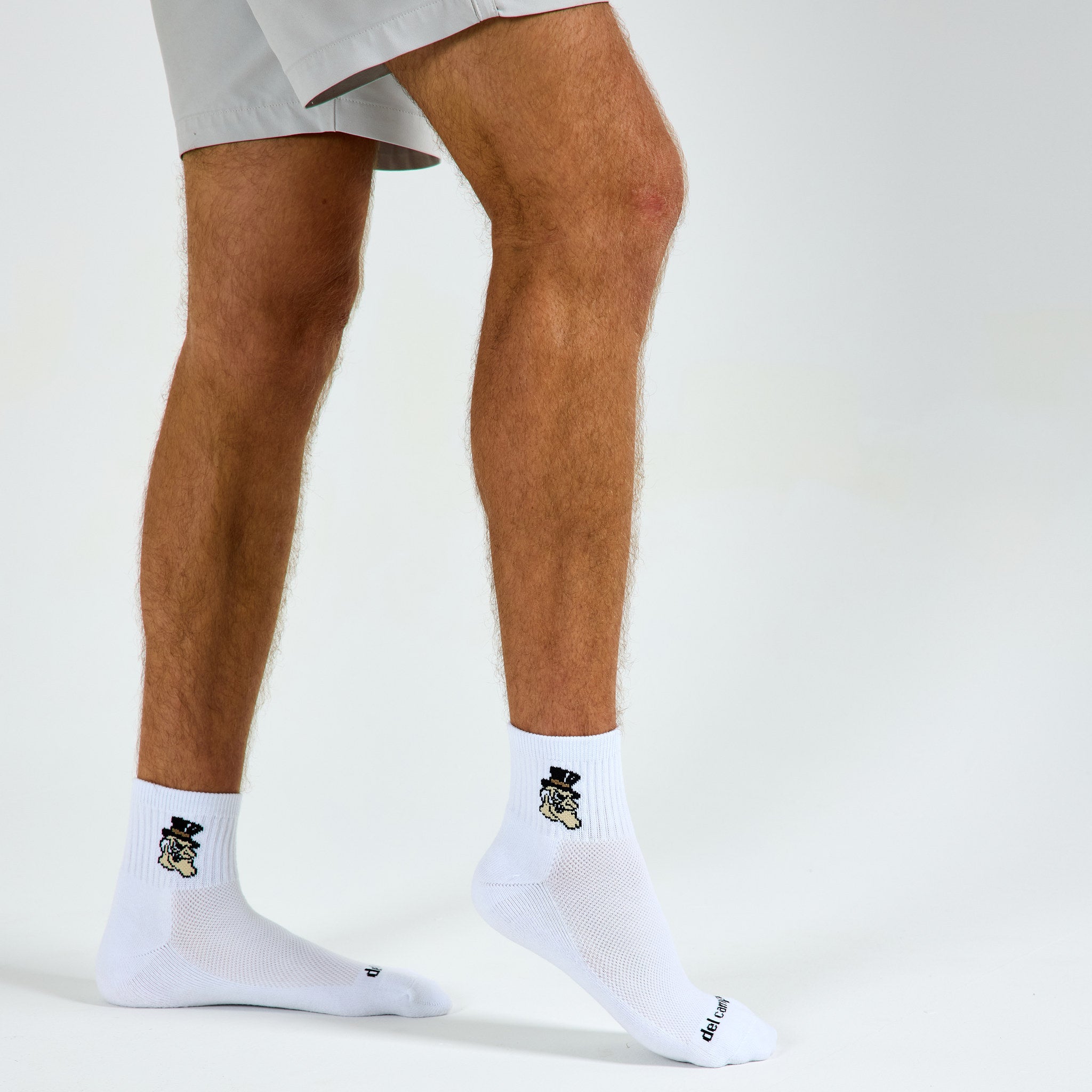 Del Campo Wake Forest Demon Deacons golf socks on a male model in studio