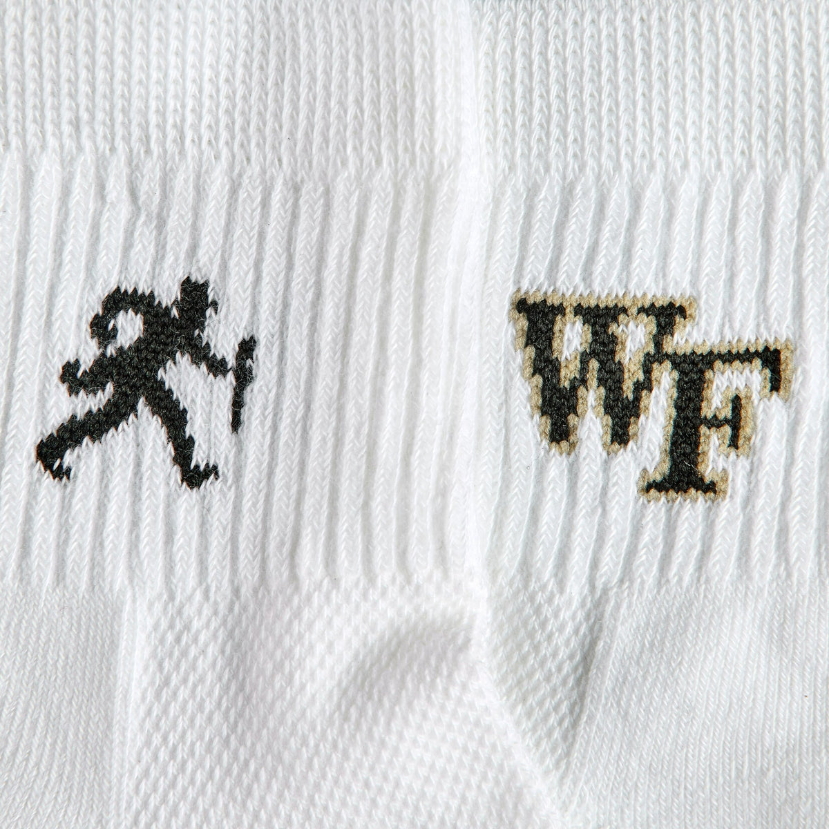 Close-up of the running Demon Deacon silhouette on Del Campo Wake Forest Walking Deacon golf socks