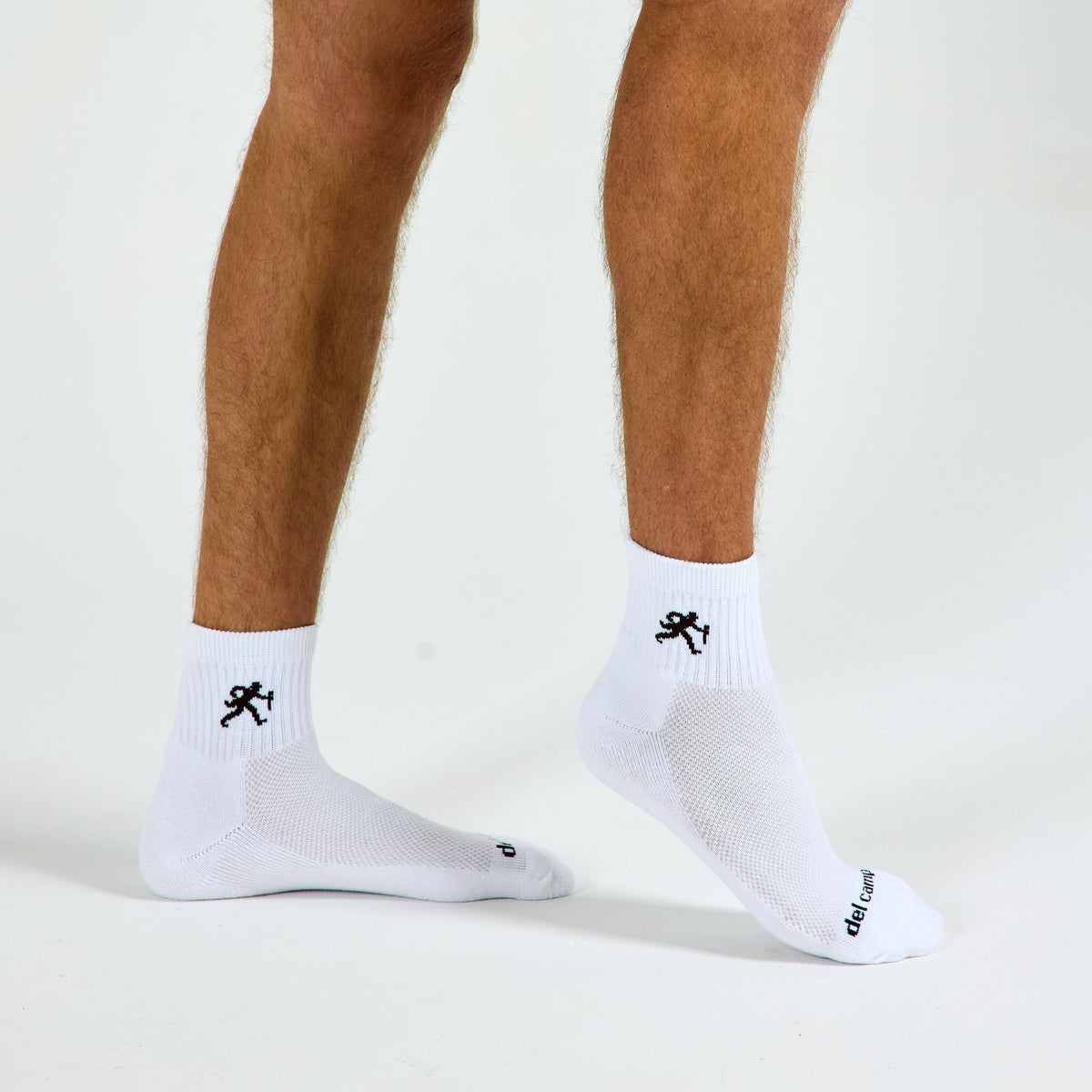 Man wearing Del Campo Wake Forest Walking Deacon golf socks, studio shot, no shoes