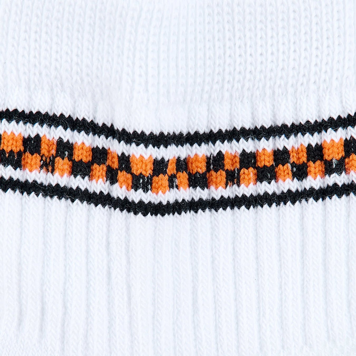 Del Campo Halloween Checkered Stripe Halloween golf socks, white quarter socks with a black and orange checkered stripe, close-up of the knit checkered band