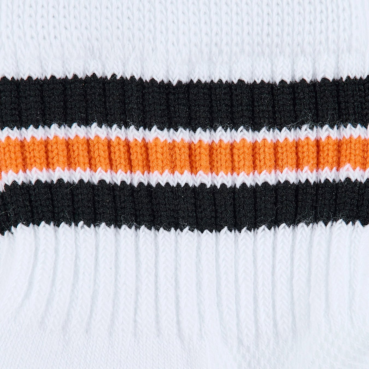 Del Campo Halloween 3 Stripe golf socks, white quarter socks with black, orange and black stripes, close-up of the knit black and orange stripes