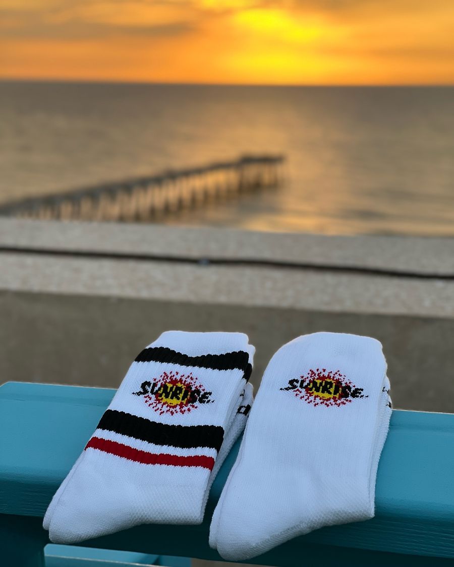 Custom Sunrise Surf Shop logo golf socks by Del Campo